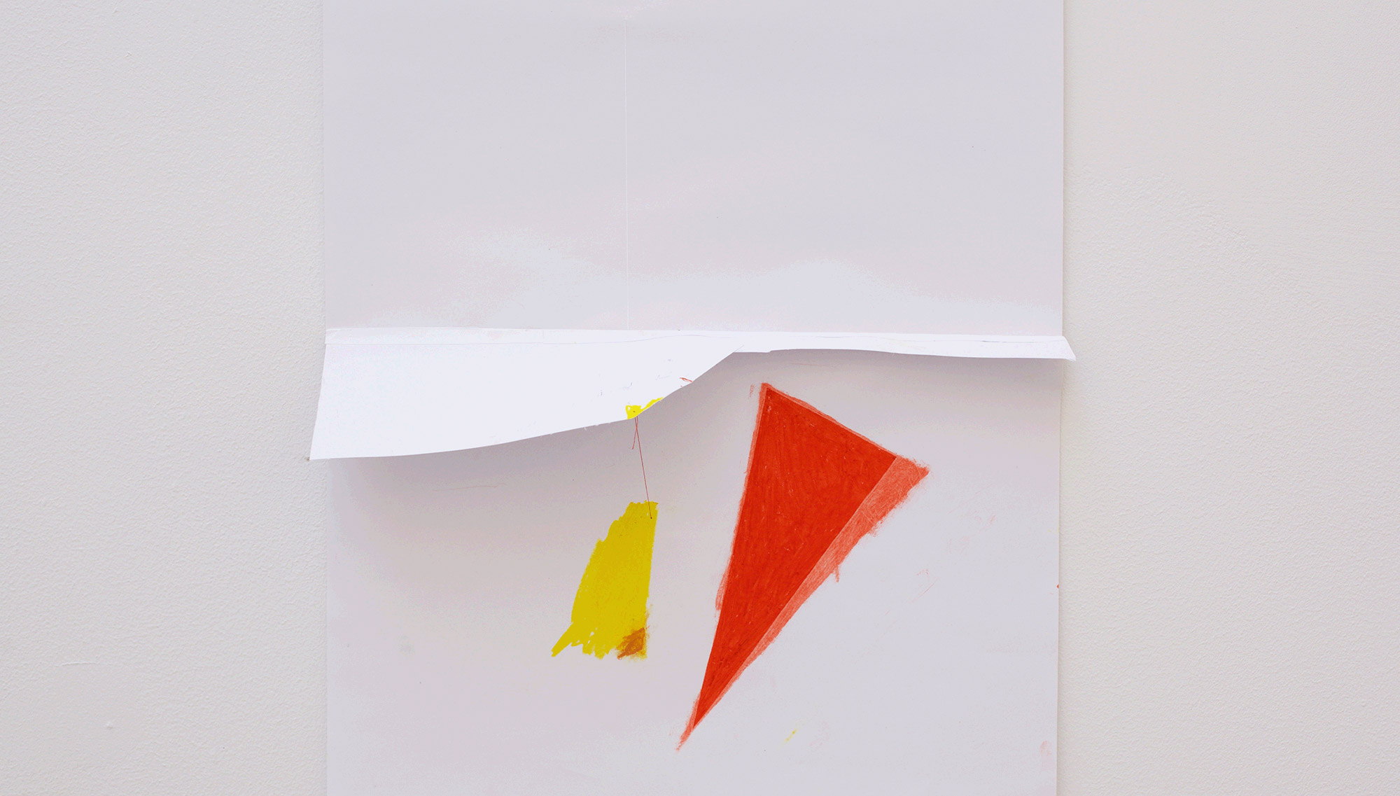 Red triangle and sewn yellow spot 